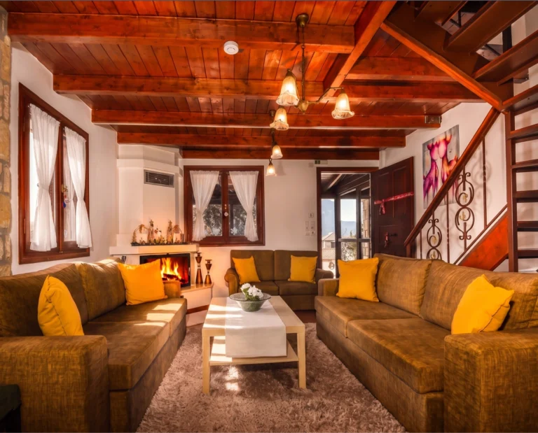 5_ΔΗΜΗΤΡΑ_living-room-with-yellow-sofas-and-fireplace